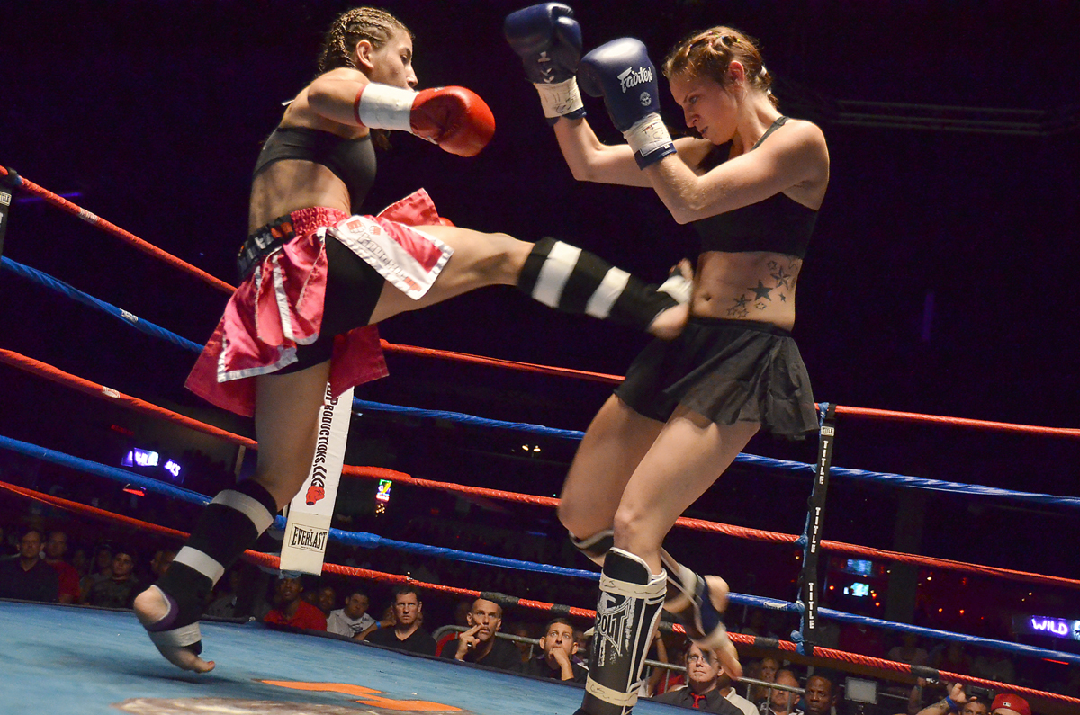 Two women competing in a Muay Thai bout in an archival photograph