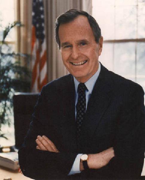 George H. W. Bush in an official Oval Office portrait.
