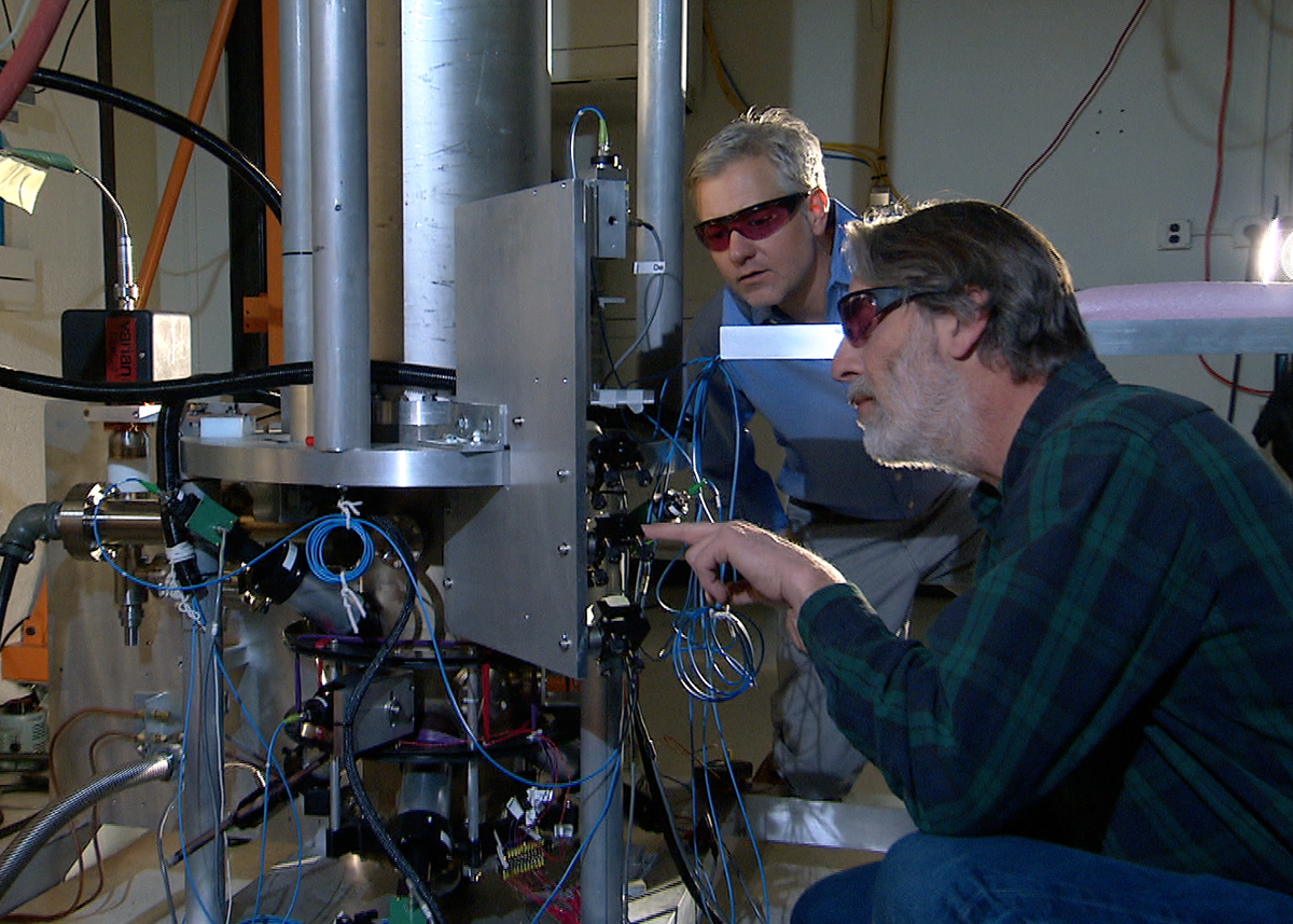 NIST researchers beside the NIST-F2 atomic clock